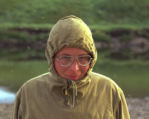 Photo of Alexei Herman surrounded by a cloud of mosquitos